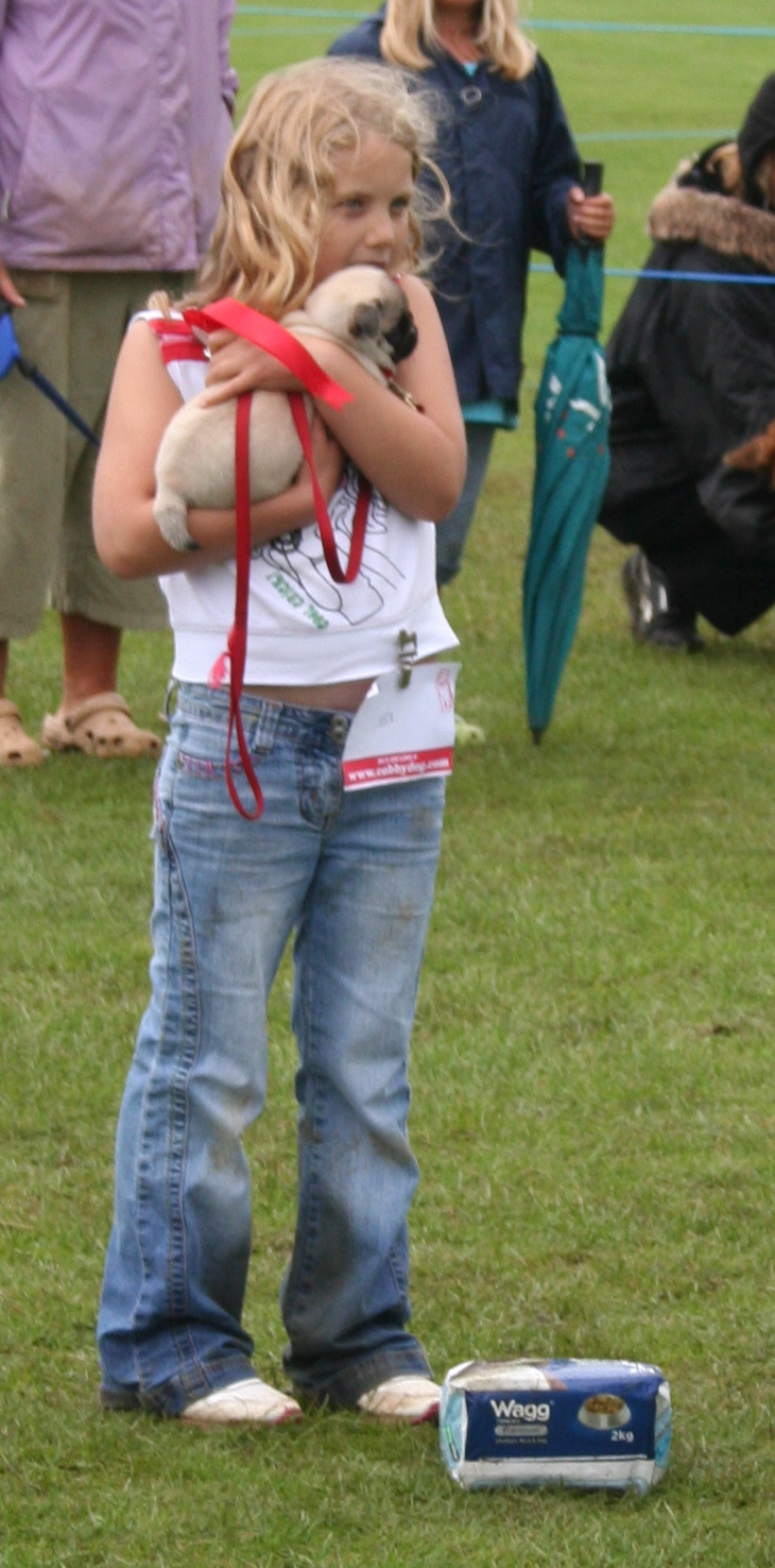 child, dog in arms